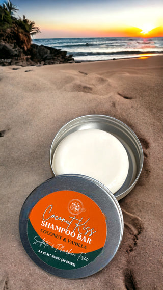 Coconut Kiss Shampoo Bar tin open on a beach at sunset