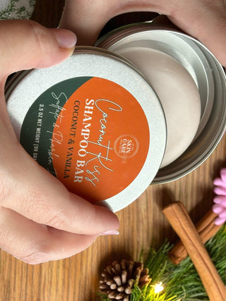 Coconut Kiss Shampoo Bar tin open, showing the coconut and vanilla shampoo bar inside
